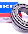Heavy Duty 22211 E Spherical Roller Bearing Size 55X100X25 Millimeters With C3 Slightly Increased Radial Clearance next to box.