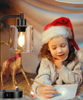 Set Of 2 Industrial Table Lamps With USB C And USB A Ports And Outlet beside child in Santa hat, glass shade illuminated.