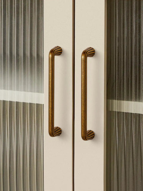 Close-up of 10 Pack Vintage Antique Brass Cabinet Pulls With An Exact 5 Inch Hole Center Solid Zinc Alloy Drawer Handles on cabinet doors