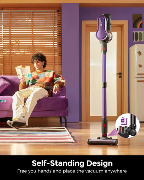 Cordless Vacuum Cleaner With 500W Motor And 45KPa Suction standing upright in a living room, showcasing self-standing design.