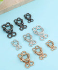 Assorted zinc alloy hook and eye closures in silver, gold, and black for Heavy Duty Hook And Eye Sewing Kit.