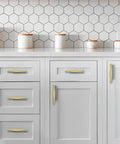 Tough As Nails Brushed Brass Cabinet Pulls 10 Pack 8 Inch Hole Center, mounted on modern white cabinetry with hexagon backsplash.