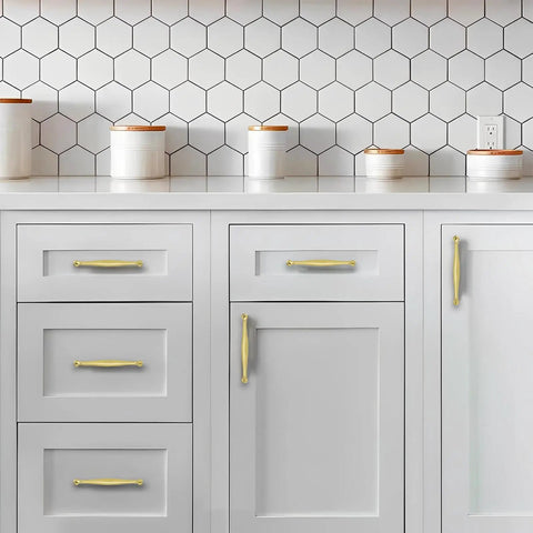 Tough As Nails Brushed Brass Cabinet Pulls 10 Pack 8 Inch Hole Center, mounted on modern white cabinetry with hexagon backsplash.