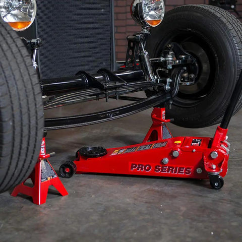 Heavy Duty Hydraulic Low Profile Floor Jack With Dual Piston Quick Lift Pump And 3.5 Ton 7000 Lb Capacity under a vehicle wheel.