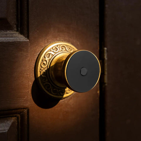 Heavy Duty Stainless Steel Decorative Deadbolt Cover Plate For Entry Doors with Slick Black Round Filler on a vintage door knob.