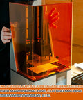 No Nonsense Heavy Duty Orange Laser Safety Shield Featuring Solid Optical Density Filter Blocking Harmful Ultraviolet And Blue Light Up To Five Forty Nm For Pro Shop Applications, showing a laser guard in use with a fiber laser machine.