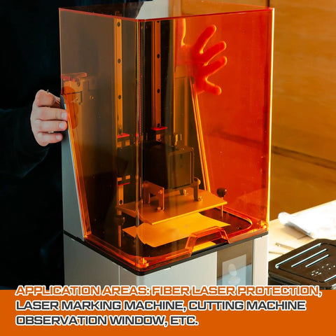 No Nonsense Heavy Duty Orange Laser Safety Shield Featuring Solid Optical Density Filter Blocking Harmful Ultraviolet And Blue Light Up To Five Forty Nm For Pro Shop Applications, showing a laser guard in use with a fiber laser machine.
