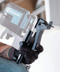 Wall and Ceiling Mount Bracket for Laser Levels, Drop Ceiling Clamp held by a person in gloves, showing screw attachment detail.