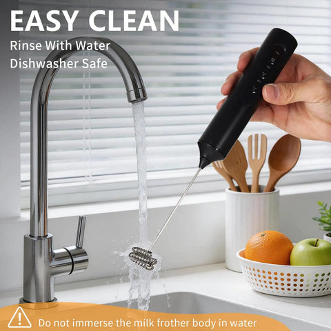 Rechargeable Handheld Milk Frother With Stand 3 Speeds And 3 Detachable Stainless Steel Whisks Electric Drink Mixer being rinsed under a faucet