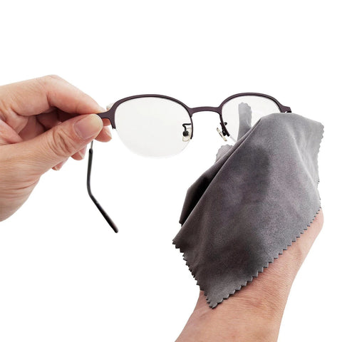 Xthel microfiber glasses cleaning cloth, gray, close-up view with eyeglasses