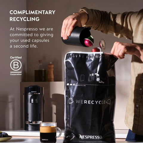 Person recycling coffee capsules with a Vertuo Pop Plus Coffee And Espresso Maker With Aeroccino3 Milk Frother in the background.