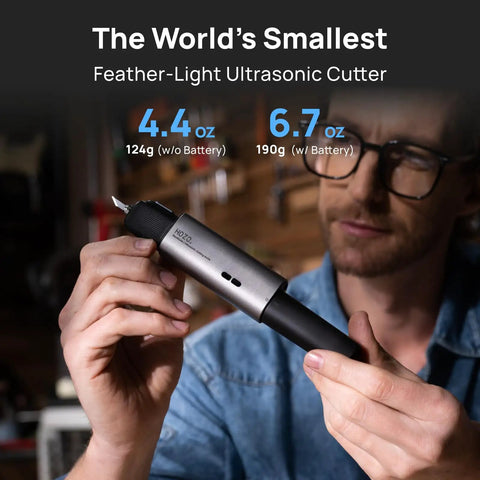 Man holding Feather-Light Wireless On The Go Ultrasonic Cutter With 40kHz Vibration And 40W Auto Power, showing size and grip.