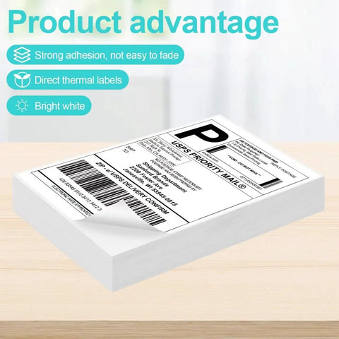 Heavy Duty 4X6 Thermal Shipping Labels 240 Count Boasting Bombproof Adhesive Sticking Like Glue Water Resistant Sheets stacked on a wooden surface.
