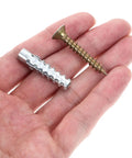 Hand holding Heavy Duty Drywall Anchors And Screws Kit with rust proof steel expansion anchors, ideal for wall mounts.