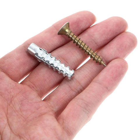 Hand holding components from 40 Pack Drywall Anchor Screw Kit For Hollow And Wood Walls Heavy Duty Rust Proof Steel Expansion Anchors