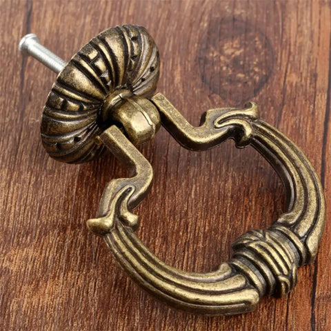 Antique Bronze Pull Handle Ring Knob Set 2pcs Vintage Europe Style Cabinet Drawer Hardware, copper finish, on wooden surface