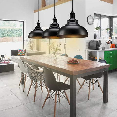 Matte Black Industrial Farmhouse Pendant Lights 3 Pack With Adjustable Rope Hangs over a modern kitchen island