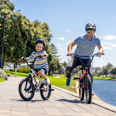 Father and child on bikes using Two Pack 20 Inch Bike Tubes 20x1.75 To 2.125 Premium Butyl Inner Tubes With 32mm Schrader Valve