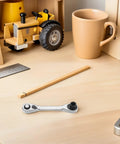 Heavy Duty Mini Ratchet Wrench 2 Pc Double Ended Socket Set Featuring A Smooth 72 Tooth Quick Release Drive and compact on a desk.