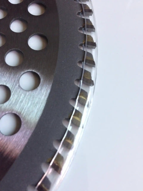 Close-up of Three Pack Carbide Tipped String Trimmer Blades Eight Inch showing cutting teeth and holes for efficient brush cutting.