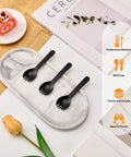 Mini Black Sporks 4.2 Inch 100 Pack Individually Wrapped Disposable Cutlery Set displayed on tray with dessert and magazine