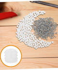 Two Hundred Piece Cabinet Fitting Kit With Rock Solid Self Tapping Screws And Heavy Duty Metal Connectors scattered on wood.