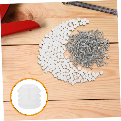 Two Hundred Piece Cabinet Fitting Kit With Rock Solid Self Tapping Screws And Heavy Duty Metal Connectors scattered on wood.