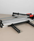 Beefy 24 Inch Manual Tile Cutter Featuring Slick Double Rail Guide System And Wide Aluminum Base on a light surface.