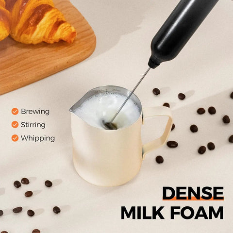Rechargeable Handheld Milk Frother With Two Stainless Steel Whisk Heads And Three Speed Settings making foam in a cup