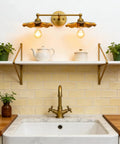 Two Light Industrial Metal Wall Sconces With Antique Brass Flower Ripple Shade above kitchen sink and shelf