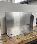 Rock Solid EV Charger Protective Housing And Weather Sealed Outdoor Enclosure showing rugged stainless steel base on workbench.