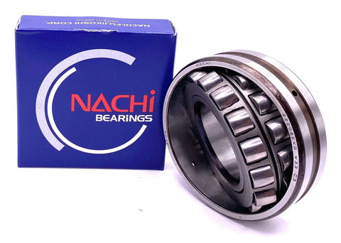 40X80X23 MM Spherical Roller Bearing 22208 EXQW33 C3 Made In Japan next to branded packaging, showing open configuration and lubrication holes.