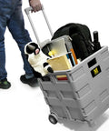 Collapsible Gray Rolling Dolly With Adjustable Handle And Extra Storage For Classroom, Office, And Grocery Runs, Durable Wheels, Easy Fold Design, 250lb Capacity Cart That Makes Moving Messes In A Snap being pulled with items inside
