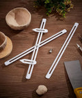 Adjustable Pottery Throwing Gauge Set With White Height Ruler And Extendable Measuring Arms For Clay Modeling on wooden table.