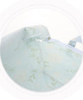 Close-up of the zipper on a heavy duty cotton quilt bag for storage, featuring floral patterns and sturdy handles.