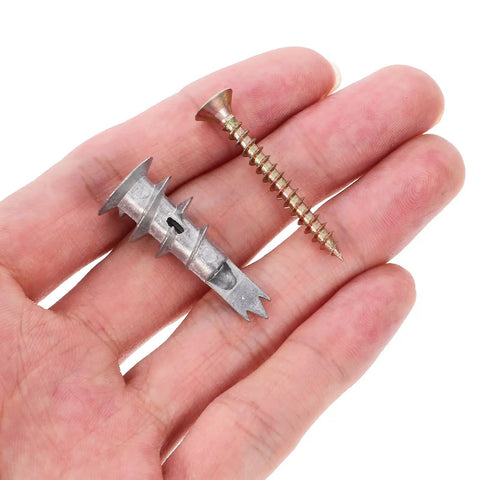 Hand holding Heavy Duty Drywall Anchor Kit With Screws, 20 Sets, Self Drilling Zinc Alloy and Iron, easy insertion anchors and screws