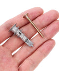 Close-up of hand holding zinc alloy anchor and screw from 20 Piece Drywall Anchor Kit With Self Drilling Screws And Self Tapping Fasteners Heavy Duty Spiral Design.