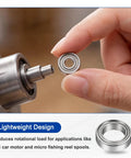 Close-up of 2 Pack SMR117ZZ Hybrid Ceramic Bearings 7x11x3mm ABEC7 in hand, ideal for RC car motors and fishing reels.