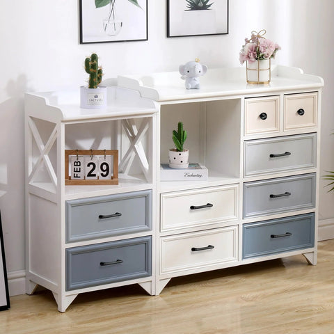 Modern dresser with multicolored drawers and decorative items on top, featuring matte black cabinet pulls.