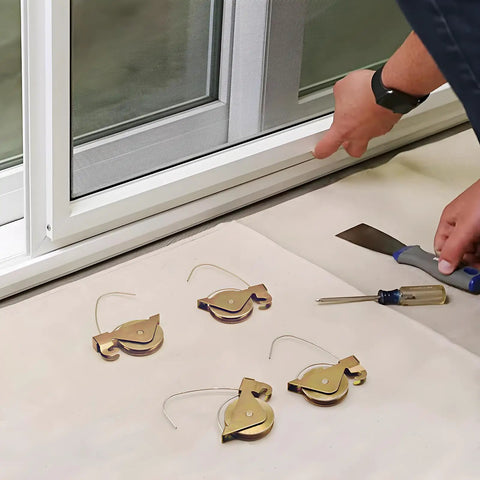 Heavy Duty Sliding Screen Door Tension Spring Rollers With One And One Quarter Inch Steel Concave Ball Bearing Wheels Fits KDEX20 Series KD Screen Doors Four Pack Replacement shown beside an installation site with tools