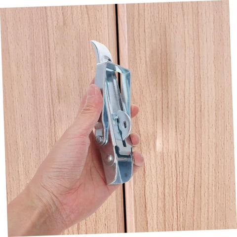 Hand holding Heavy Duty Adjustable Draw Latch For RVs Trailers And Toolboxes Easy Install Locking Mechanism against wood surface