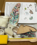 Box contents of DIY Mosaic Kit For Adults With Feather Bird Cat And Heart Designs including tools and instructions