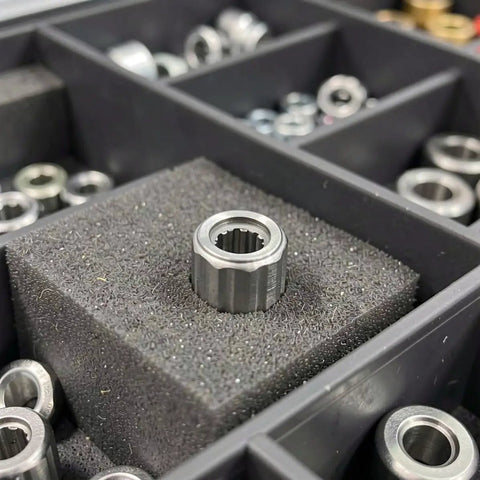 4 Pcs One Way Clutch Needle Roller Bearing Overrunning Unidirectional Radial Design in compartment tray, showing detailed metal construction.