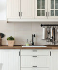 Modern kitchen with 30 Pack 4 Inch Square Kitchen Cabinet Handles Matte Black Drawer Pulls installed on white cabinets