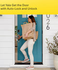 Rock Solid Smart Deadbolt With Wireless Wifi And Touchscreen Keypad For Hassle Free Keyless Entry Tight Auto Lock Security And Sleek Passage Lever Handle In Satin Nickel Pack Of Three, woman entering home with bags.