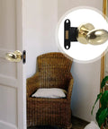 Sleek Concealed Door Handle Featuring Smooth As Butter Swing Dead Nuts Secure Integrated Deadbolt Lock Brushed Stainless Steel Finish For Bedroom Use Zero Drama Install Heavy Duty Performance Quiet Close Hardware Modern Minimalist Style on a door with a woven chair in background.