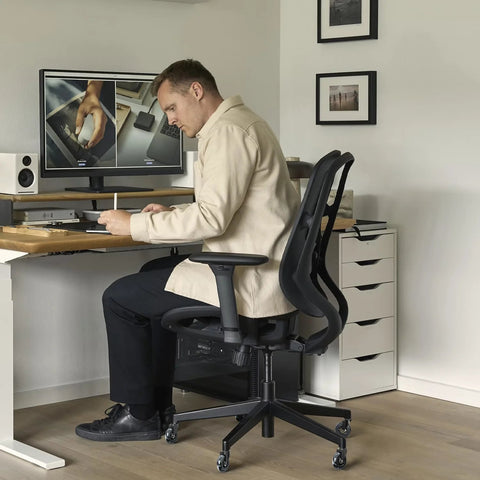 Office chair featuring Rollerblade Casters 3 Inch 11x22mm All Black Set Of 15 in a home office setting.