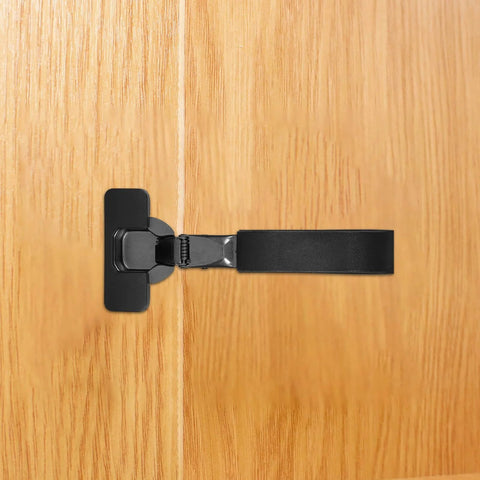 Side view of a Slick Soft Close Concealed Cabinet Door Hinge With Silent Damping For Kitchen Cabinets, black, installed on wood.