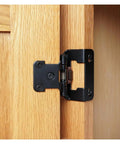 Heavy Duty Concealed Cabinet Hinges Half Overlay Partial Wrap Arms For Kitchen Makeovers shown on oak cabinet door.