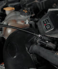 Flexible Socket Extension Set for 1/4 and 3/8 Inch Drive being used on car engine to loosen tight bolts in hard to reach spots.